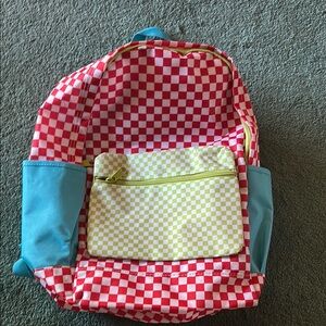 Red and White Checkered Bag with Playful Design